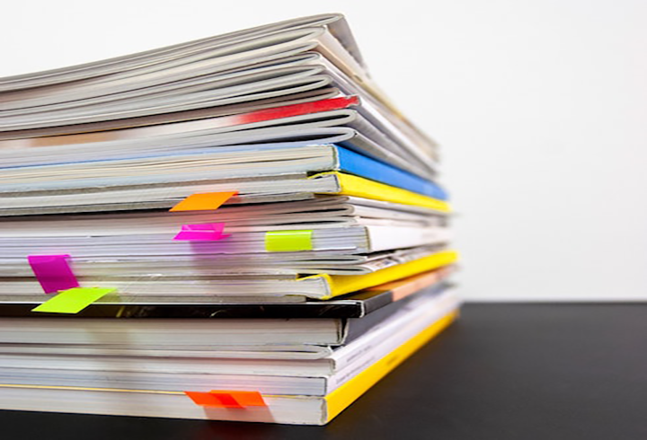 Pile of Books with notes sticking out